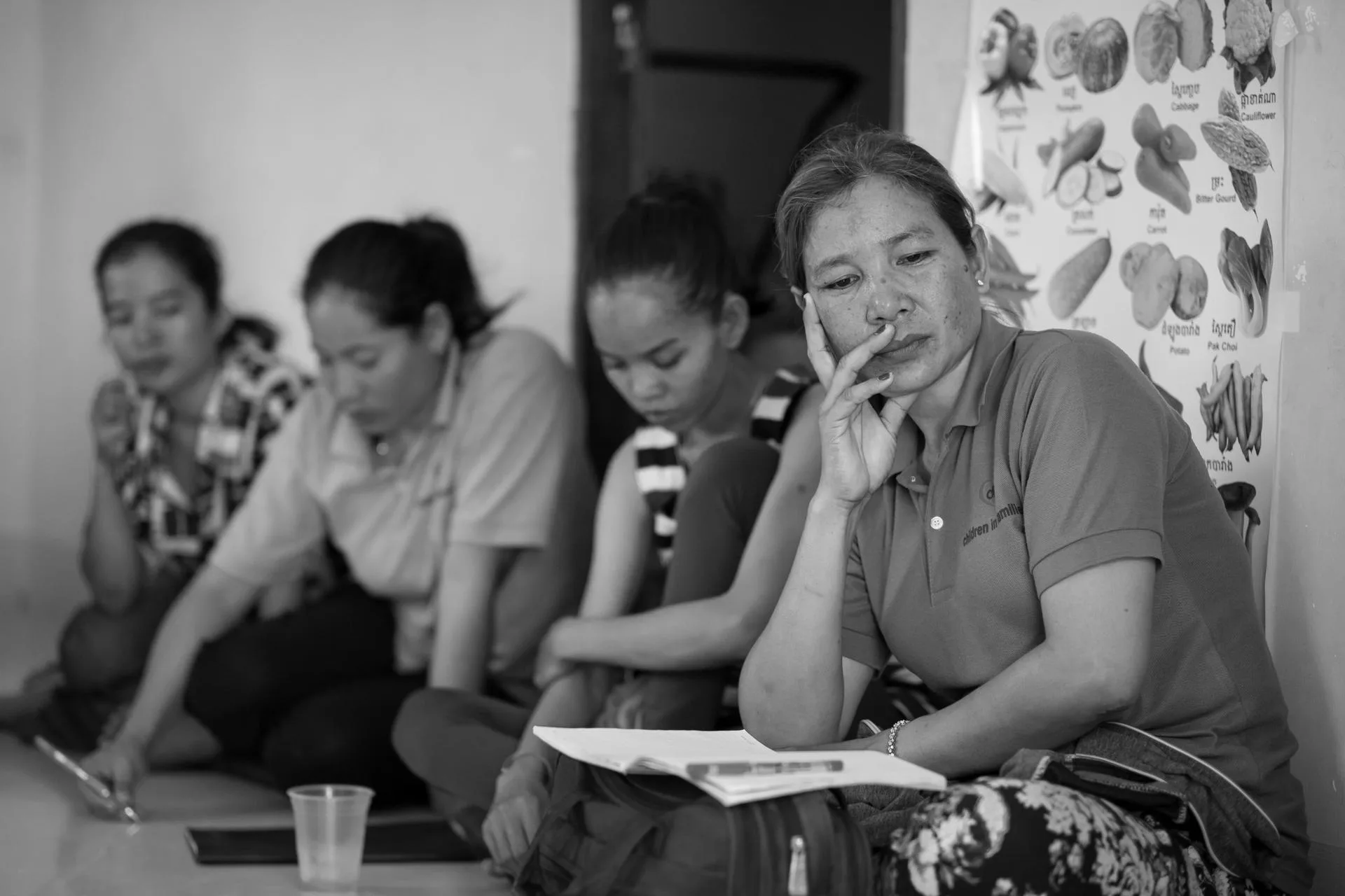Staff listen during a meeting, discussing some of CIF's clients' complex needs.